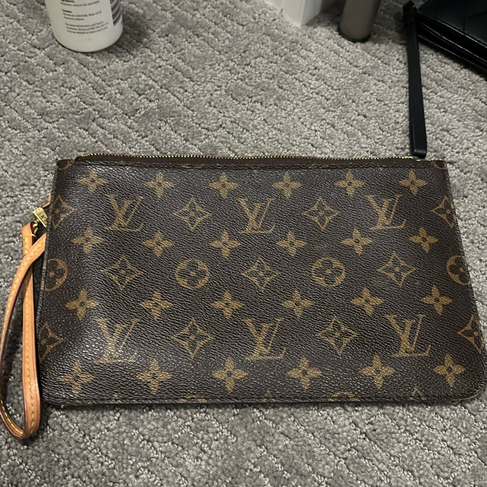 Louis Vuitton pouch. never used. 6 “ x 9”